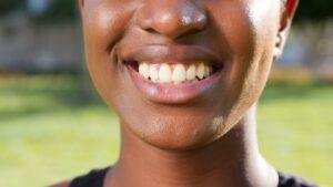 Patient managing tooth sensitivity after a professional dental cleaning in Richmond Hill